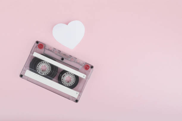 istock Audio cassette tape on pink backgound 1263595252