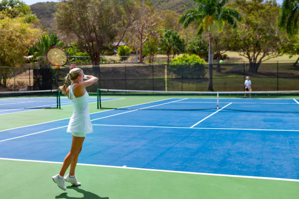 istock couple playing tennis in tropical climate 1263598291