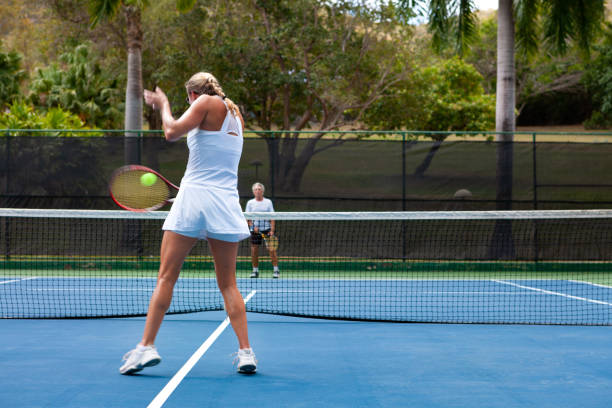 istock couple playing tennis in tropical climate 1263598400