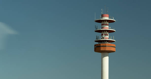 istock Shot of large manned transmission tower against a blue sky 1263602700