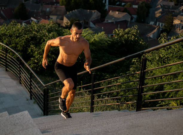 outdoor workout at sunset - shirtless energy action effort imagens e fotografias de stock