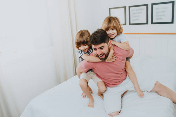 istock Father playing with his kids, fun waking up in the morning 1263608232