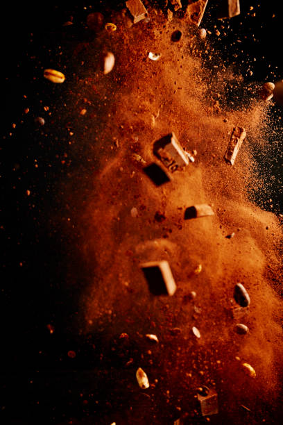 istock Chocolate Food Explosion with Cocoa Powder, Chocolate Chips and Nuts 1263609067