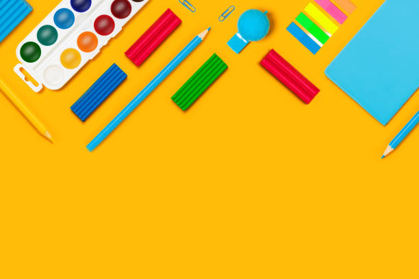 istock Yellow paper with writing materials. 1263609445