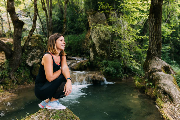 istock Young female nature explorer by the creek 1263610912