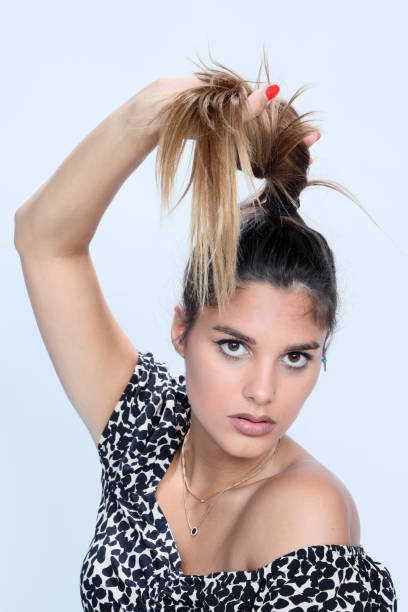 istock Beautiful brunette female model posing in studio on isolated background. 1263611603