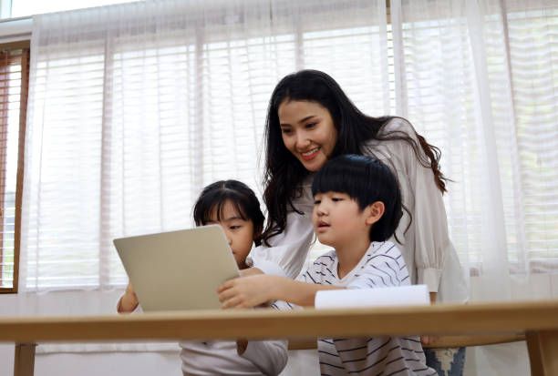 istock Happiness two children learning on smart phone at home in holiday weekend. 1263611813