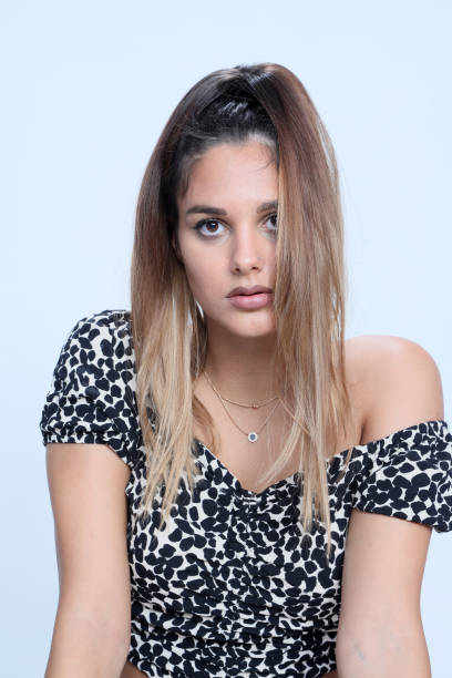 istock Beautiful brunette female model posing in studio on isolated background. 1263613516