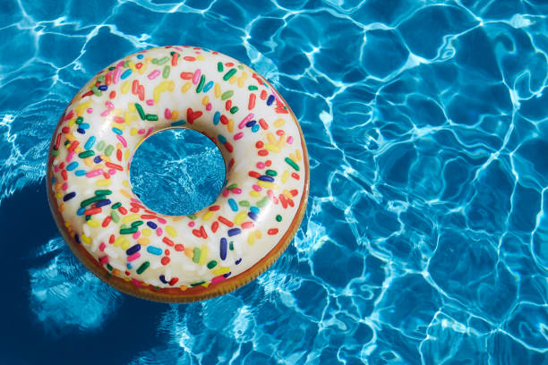 istock Inflatable donut ring in blue swimming pool 1263615829