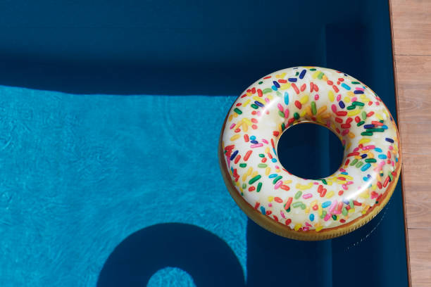 istock Inflatable donut ring in blue swimming pool 1263615906