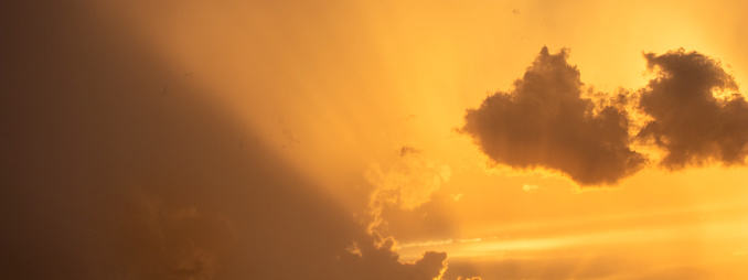 Sunset / sunrise with dramatic cloudscape, vivid colors and negative space for copy