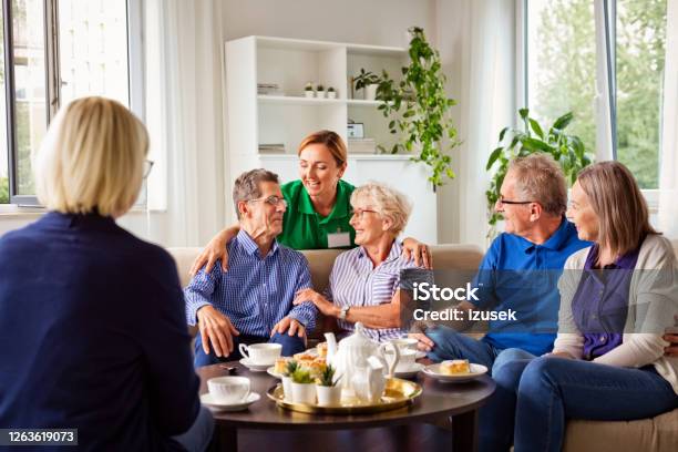 Cheerful Senior People In Retirement House Stock Photo - Download Image Now - Nursing Home, Assisted Living, Community Outreach