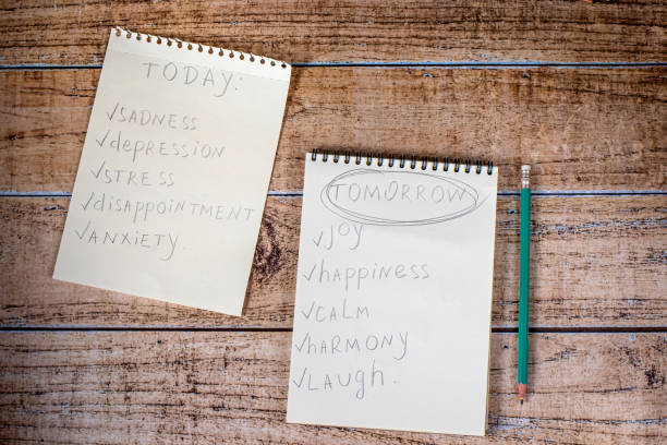istock Notepad and green pencil on a wooden background. Motivational quotes. 1263620131