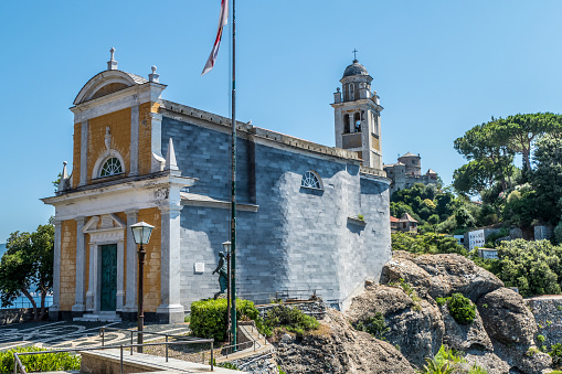 The church of San Giorgio in Portofino with a castle in background
