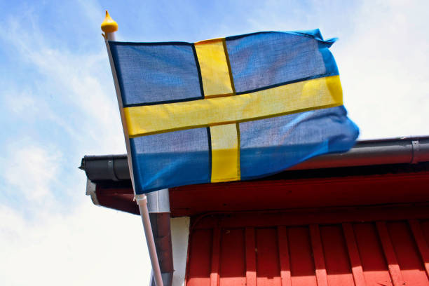 istock Swedish flag on a red wooden house 1263620784