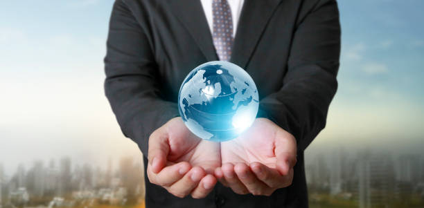 istock Globe ,earth in human hand, holding our planet glowing.  image provided by Nasa 1263624729