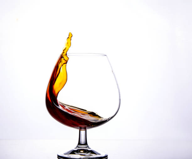 istock Crystal Glass with Splash of Brandy. 1263625517