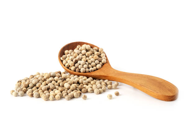 istock Peppercorns in wooden spoon 1263625711