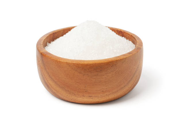 istock White sugar in wooden bowl isolated on white background 1263625809