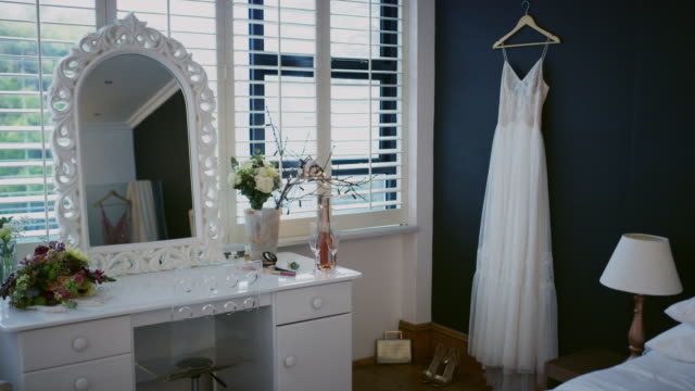 4k video footage of a wedding dress and accessories in a room