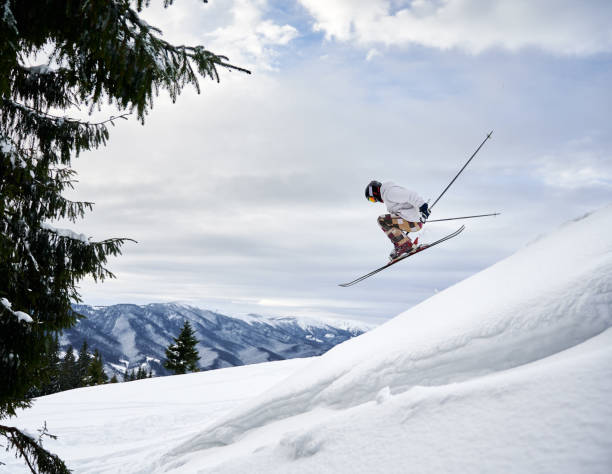 istock Man skier skiing downhill in snowy mountains. 1263627733