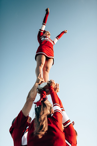 cheerleader team creating a perform