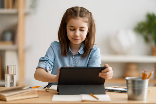 istock Girl doing homework or online education. 1263630647
