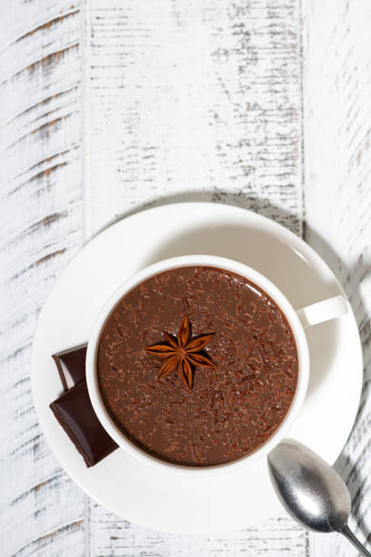 istock cup of hot spiced chocolate, vertical top view 1263631208