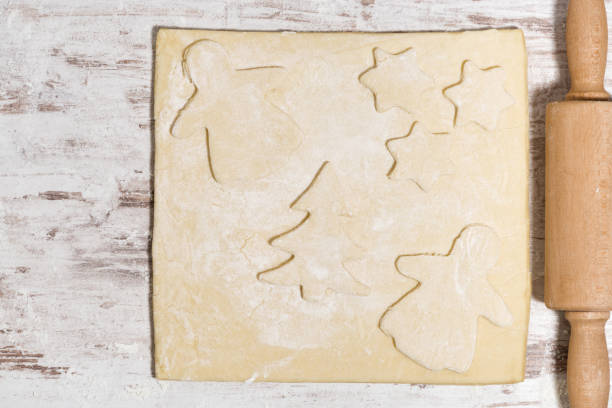 istock dough for baking Christmas cookies and rolling pin, closeup 1263631259