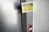 elevator out of service sign attached to elevator door