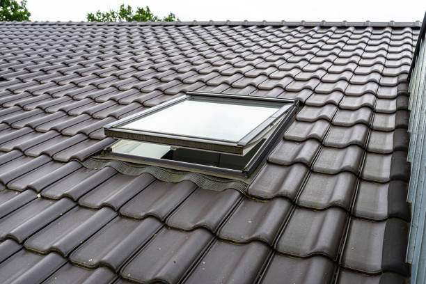 istock One open roof window in the attic, visible anthracite ceramic tiles. 1263632616