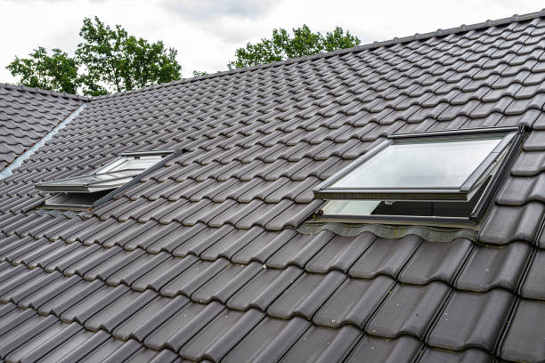 istock Two open roof windows in the attic, visible anthracite ceramic tiles. 1263632623