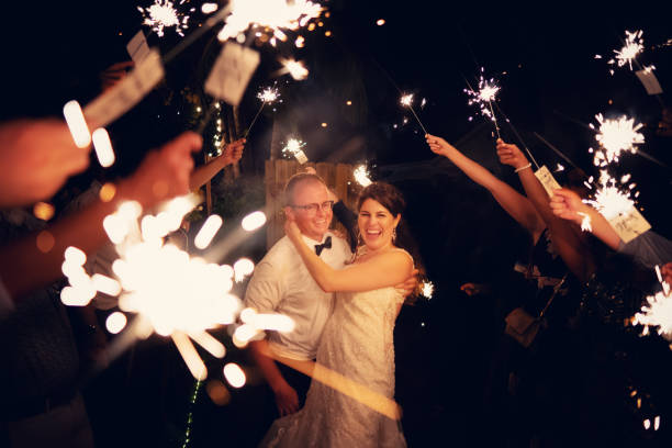 Newlyweds walking among sparkle lights on their wedding day