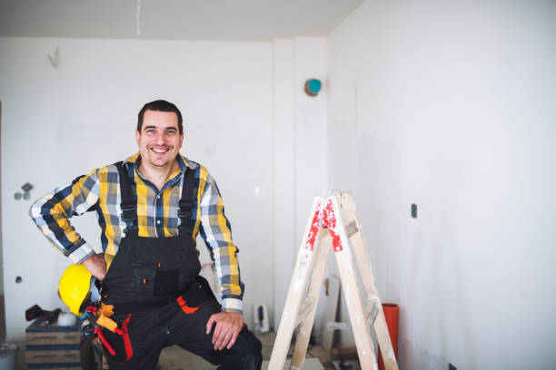 Charming Construction Worker Smiling And Holding His Helmet