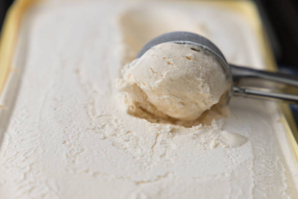 istock scoop of vanilla ice cream in a box 1263638646