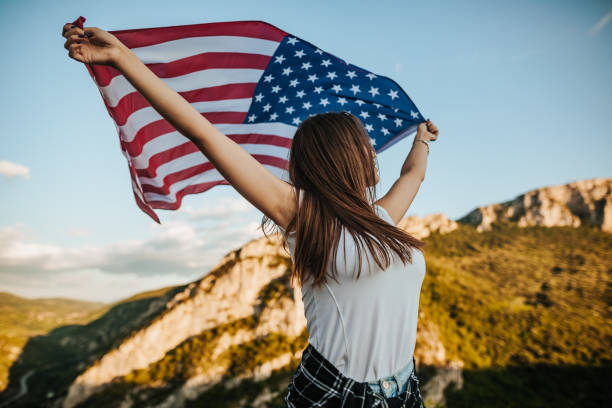 istock Young woman with American flag 1263638690