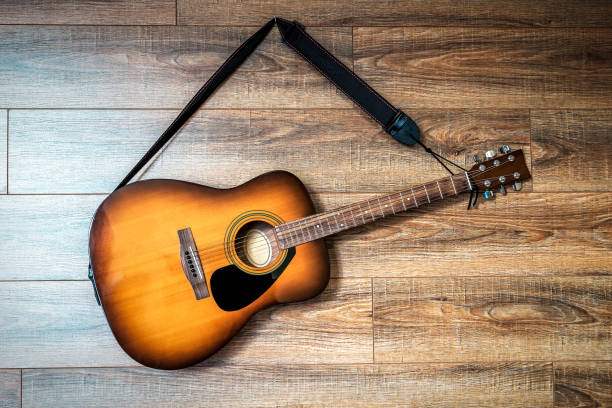 istock acoustic guitar hanging on the wall 1263638706