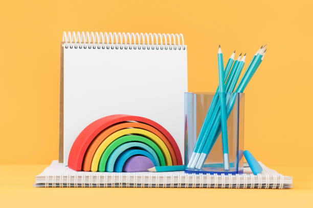 istock Wooden rainbow with pencils and a sketchbook 1263638768