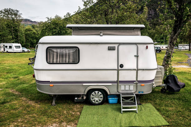 istock camping trailer stands in campsite 1263638838
