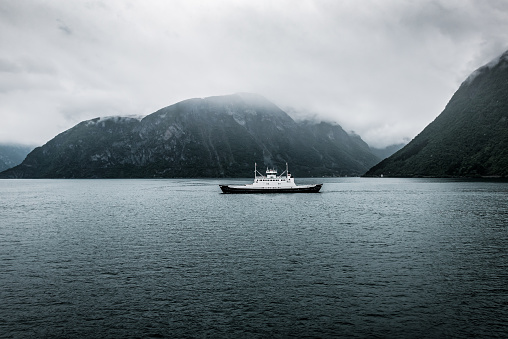 ferry boat floats in the fjord in Norway