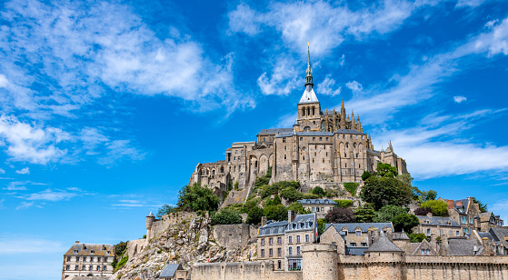 Mont St Michael Church Spire over Village Roofs in France