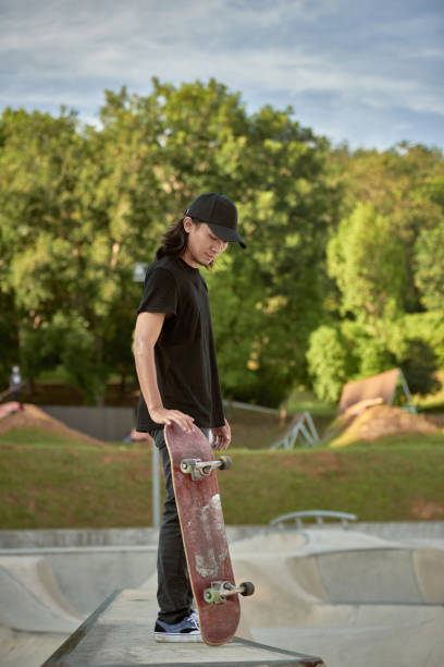istock Portrait of Asian skateboarder 1263640825