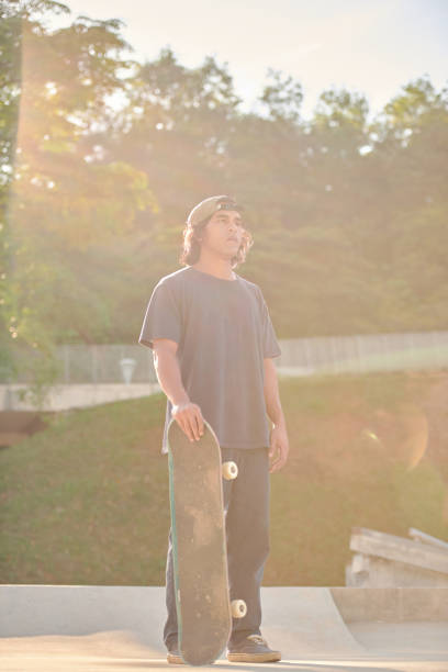 istock Portrait of Asian skateboarder 1263641965