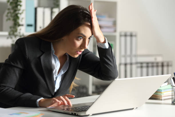 istock Surprised executive discovering mistake on laptop at office 1263642066