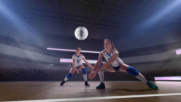 Volleyball. Female professional volleyball players in action on 3d stadium. volleyball sport stock pictures, royalty-free photos & images