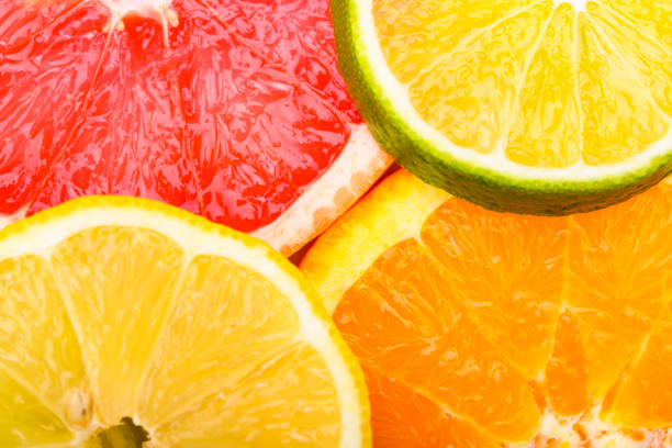 istock Colorful Citrus fresh fruits including grapefruit, lime, lemon and orange cross section studio shot 1263646295
