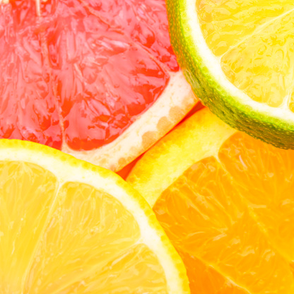 Colorful Citrus fresh fruits including grapefruit, lime, lemon and orange cross section studio shot