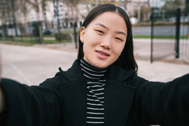istock Asian woman taking a selfie. 1263646351