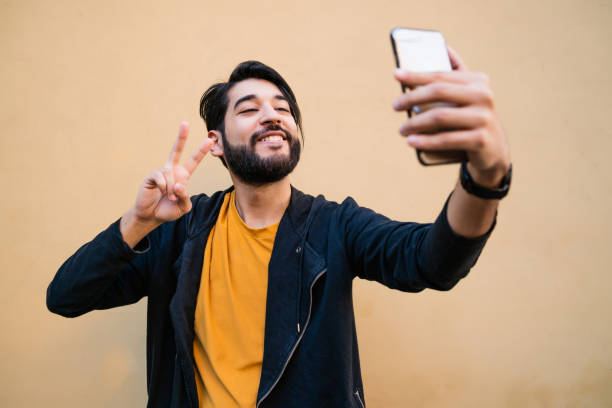 istock Young man taking selfies with phone. 1263646398