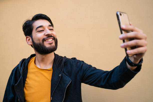 istock Young man taking selfies with phone. 1263646403